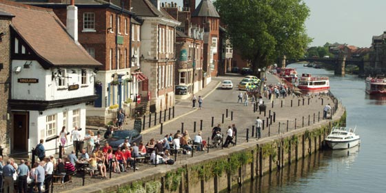 The Kings Arm pub on Kings Staith is very popular for sitting out watching the river